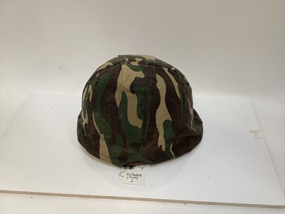 Lot 775 - American M1 steel helmet complete with liner, chinstrap and South Vietnamese camouflage cover, used by the Army of the Republic of Vietnam (ARVN) in support of US troops.