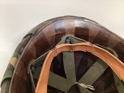 Lot 775 - American M1 steel helmet complete with liner, chinstrap and South Vietnamese camouflage cover, used by the Army of the Republic of Vietnam (ARVN) in support of US troops.