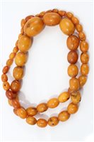 Lot 736 - Old amber bead necklace with a string of...