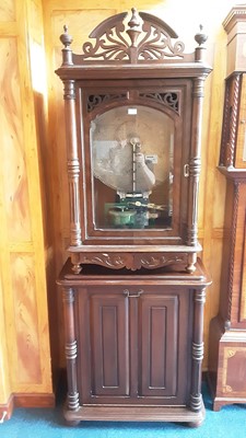 Lot 2385 - Victorian walnut cased coin operated polyphon, raised on later cabinet