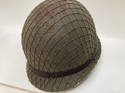 Lot 769 - Argentinian M1 steel helmet complete with camouflage painted finish, net, liner and chinstrap, believed to be a Falklands War trophy.