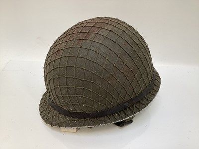 Lot 769 - Argentinian M1 steel helmet complete with camouflage painted finish, net, liner and chinstrap, believed to be a Falklands War trophy.