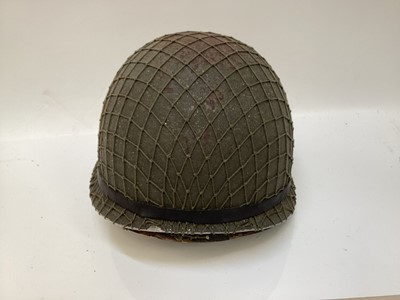 Lot 769 - Argentinian M1 steel helmet complete with camouflage painted finish, net, liner and chinstrap, believed to be a Falklands War trophy.