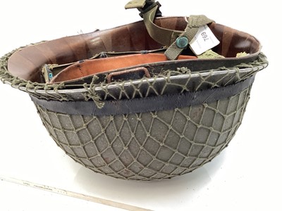 Lot 769 - Argentinian M1 steel helmet complete with camouflage painted finish, net, liner and chinstrap, believed to be a Falklands War trophy.