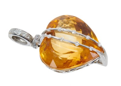 Lot 438 - Citrine and diamond heart shaped pendant
