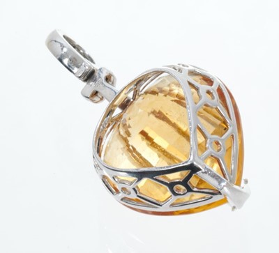 Lot 438 - Citrine and diamond heart shaped pendant