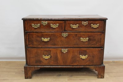 Lot 1302 - Early 18th century walnut veneered chest of two short and two long drawers