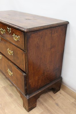 Lot 1302 - Early 18th century walnut veneered chest of two short and two long drawers