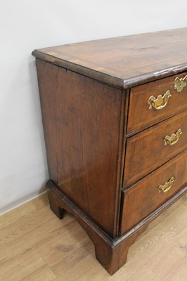 Lot 1302 - Early 18th century walnut veneered chest of two short and two long drawers