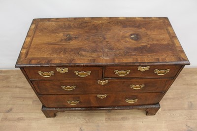 Lot 1302 - Early 18th century walnut veneered chest of two short and two long drawers