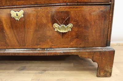 Lot 1302 - Early 18th century walnut veneered chest of two short and two long drawers