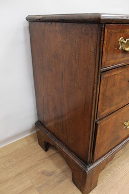 Lot 1302 - Early 18th century walnut veneered chest of two short and two long drawers