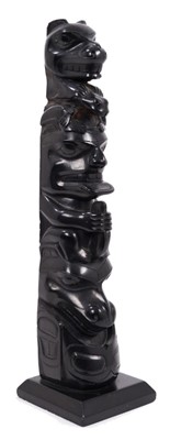 Lot 707 - Unusual Haida type carved black stone totem in the manner of Charles Edenshaw