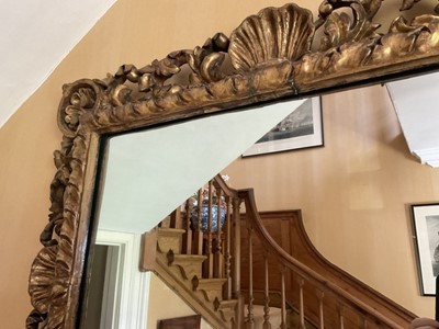 Lot 1322 - Antique baroque giltwood and gesso framed wall mirror