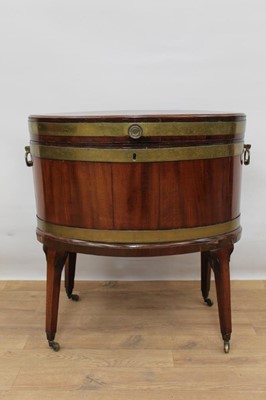 Lot 1323 - George III mahogany and brass bound oval wine cooler with original lead lined interior