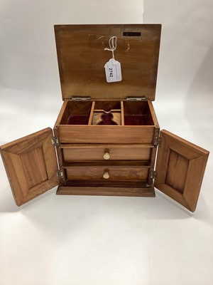 Lot 2742 - Early 20th century Olive Wood table top jewellery box, with hinged top, with space for a pocket watch and velvet lining to interior and draws. 20cm in length.