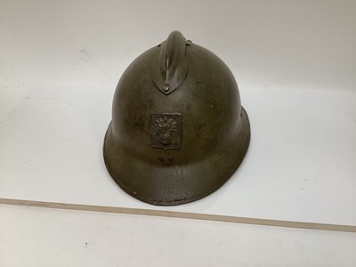 Lot 768 - French M26 steel helmet bearing the badge of the Defenc Passif (DP) Civil Defence organisation of Vichy France, with khaki paint finish, liner to interior and DP badge to front.