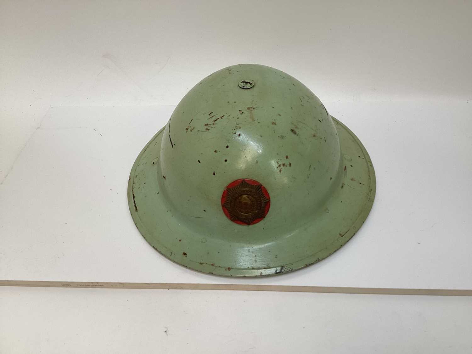 Lot 777 - Second World War British MKII steel helmet, painted green with National Fire Brigades Association badge to the front, with liner and chinstrap, inscribed 'Miller'.