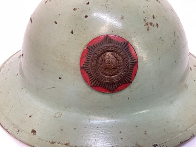 Lot 777 - Second World War British MKII steel helmet, painted green with National Fire Brigades Association badge to the front, with liner and chinstrap, inscribed 'Miller'.