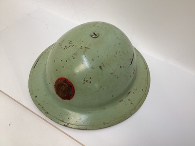 Lot 777 - Second World War British MKII steel helmet, painted green with National Fire Brigades Association badge to the front, with liner and chinstrap, inscribed 'Miller'.