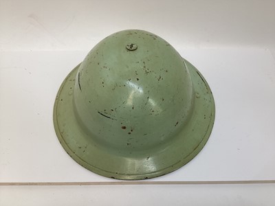 Lot 777 - Second World War British MKII steel helmet, painted green with National Fire Brigades Association badge to the front, with liner and chinstrap, inscribed 'Miller'.