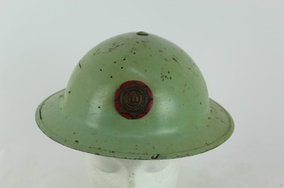 Lot 777 - Second World War British MKII steel helmet, painted green with National Fire Brigades Association badge to the front, with liner and chinstrap, inscribed 'Miller'.