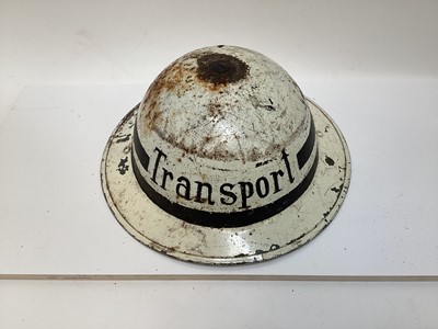 Lot 841 - Second World War British MKII steel helmet, painted white over kahki and labelled Transport, with liner, dated 1942