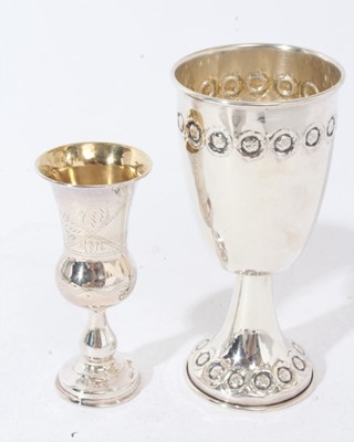 Lot 330 - Group of silver and white metal items to include an eastern white metal pedestal dish, two branch candelabra, silver wine bottle coaster, silver bon bon dish, 8 spoons and two goblets