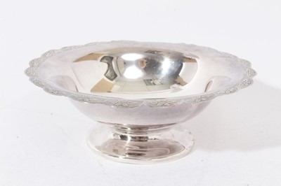 Lot 330 - Group of silver and white metal items to include an eastern white metal pedestal dish, two branch candelabra, silver wine bottle coaster, silver bon bon dish, 8 spoons and two goblets
