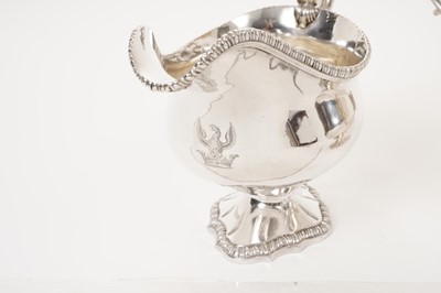 Lot 209 - Pair of George III silver sauce boats with gadrooned edging and scroll handles on pedestal  bases
