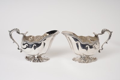Lot 227 - Pair of late Victorian silver shell shape sauce boats London 1896, together with one other