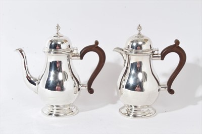 Lot 221 - George III style silver coffee pot and hot milk jug of baluster form, London 1938