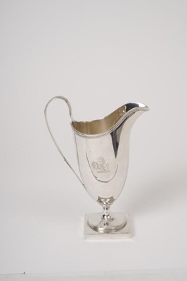 Lot 218 - George III silver helmet shape cream jug. London 1785