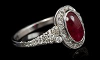 Lot 758 - Ruby and diamond cluster ring, the oval...