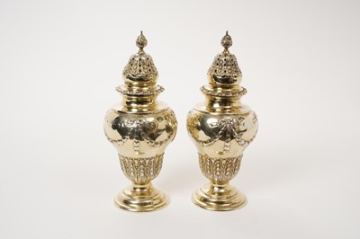 Lot 222 - Late Victorian pair of silver gilt castors and covers, London 1897/98