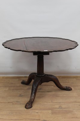 Lot 1327 - George III mahogany supper table, of large size, with piecrust top on later carved tripod base