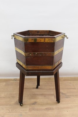 Lot 1328 - George III mahogany and brass bound hexagonal cellarette on stand (lacking lid)