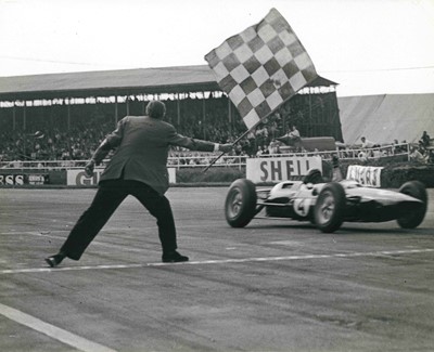 Lot 2093 - Group of approximately 20 1960's car and motorsport official press photographs to include Jim Clark, Graham Hill, Bluebird and motorshow cars