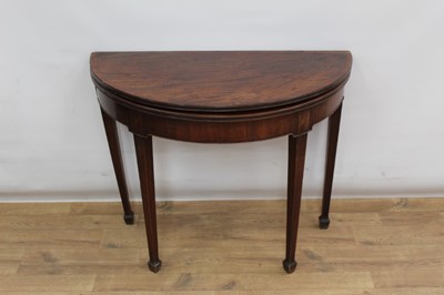 Lot 1357 - George III  mahogany demi lune tea table