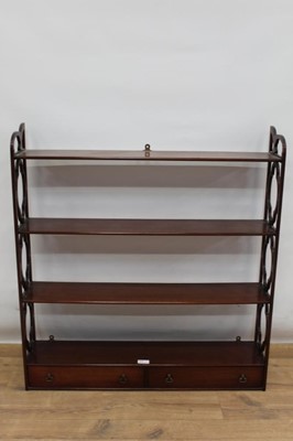 Lot 1324 - George III style mahogany three-tier hanging shelves