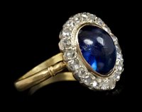 Lot 768 - Sapphire and diamond cluster ring, the...