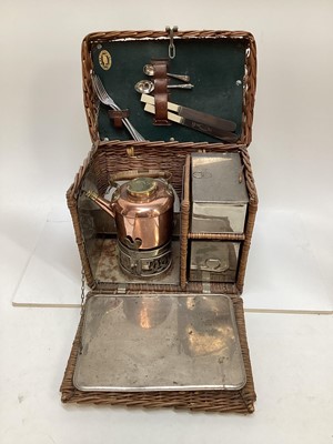 Lot 2103 - Edwardian G.W. Scott & Son wicker two person 'En Route' tea basket 'The Continental', comprising copper and brass kettle and burner, together with enamel plates, cutlery, sandwich box and other ite...