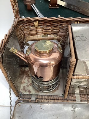 Lot 2103 - Edwardian G.W. Scott & Son wicker two person 'En Route' tea basket 'The Continental', comprising copper and brass kettle and burner, together with enamel plates, cutlery, sandwich box and other ite...