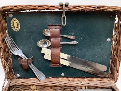 Lot 2103 - Edwardian G.W. Scott & Son wicker two person 'En Route' tea basket 'The Continental', comprising copper and brass kettle and burner, together with enamel plates, cutlery, sandwich box and other ite...