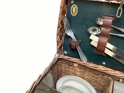 Lot 2103 - Edwardian G.W. Scott & Son wicker two person 'En Route' tea basket 'The Continental', comprising copper and brass kettle and burner, together with enamel plates, cutlery, sandwich box and other ite...