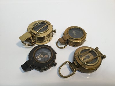 Lot 852 - Edwardian brass military compass by J.H. Steward, dated 1902, named to E.W. Chadwick on reverse, together with a First World War brass compass dated 1918, Second World War MKIII compass dated 1941...