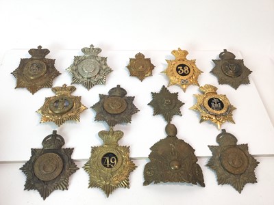 Lot 855 - Collection of approximately 13 Victorian and Edwardian blue cloth helmet plates including Officers (1 box)