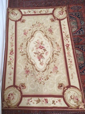 Lot 2250 - Hand woven tapestry rug/ wall hanging and similar needle point rug, both floral design.