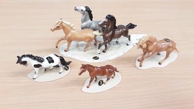 Lot 1366 - Four Hagen Renaker figures of horses