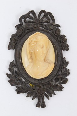 Lot 865 - 19th century Continental carved ivory cameo of a woman in a bronze frame